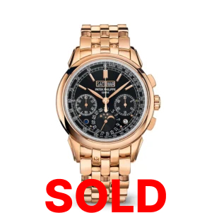 A gold watch with the words " sold " on it.