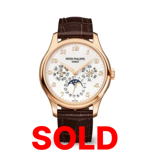 A gold watch with brown leather strap and white face.