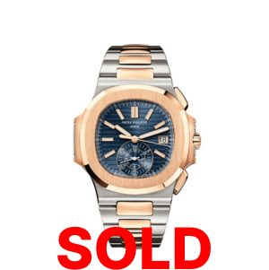 A gold and silver watch with the words " sold ".