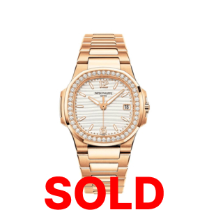 A gold watch with diamonds on it's face.