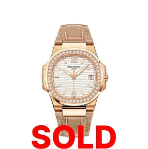 A gold watch with a white face and brown leather strap.