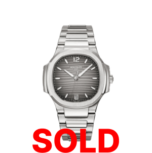 A silver watch with the words " sold ".