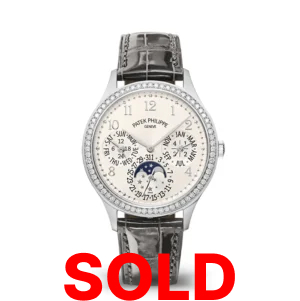 A white gold watch with diamonds on the bezel.
