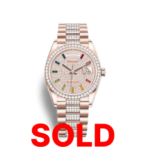 A rolex watch with the date and rainbow markers.