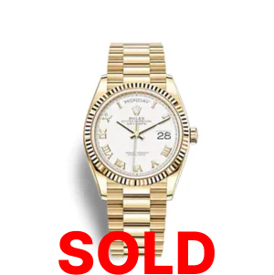 A gold rolex watch with roman numerals on it.