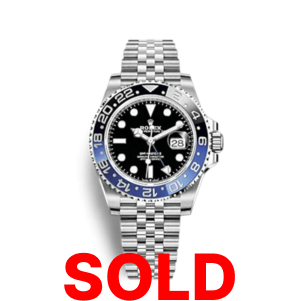 A rolex gmt master ii with blue and black bezel.