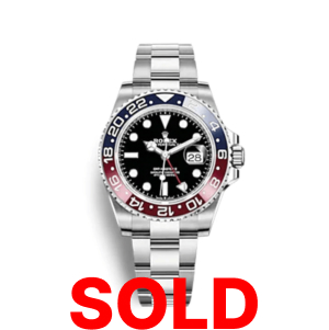 A rolex gmt master ii watch with the date and pepsi bezel.