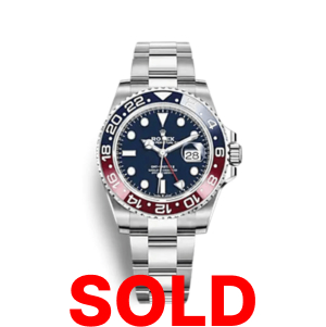A rolex gmt master ii watch with the date and pepsi bezel.