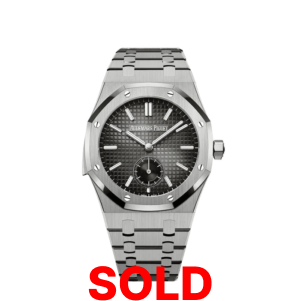 A silver watch with the words " sold ".