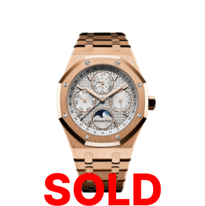 A gold watch with the words " sold ".
