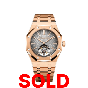 A gold watch with the words " sold ".